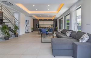 a living room with a couch and a table at Nice Home In Pula With Kitchen in Pula