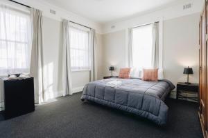 Postel nebo postele na pokoji v ubytování Hotel Gosford
