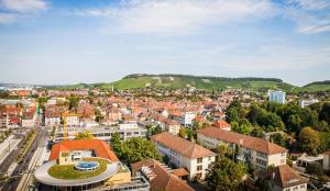 an aerial view of a city with buildings at City Hotel Heilbronn in Heilbronn +42 photos