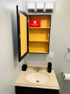 a bathroom with a sink and a mirror at Ocean Block Oasis, 2-Bed Condo in Seaside Heights +38 photos