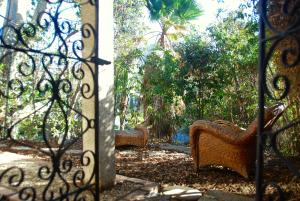 an open gate with two benches in a garden at Universal Studios-Hollywood Hills guest suite with King bed in Los Angeles +12 photos
