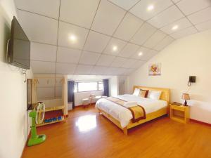 Postel nebo postele na pokoji v ubytování S481 Hoa Dang Hotel Dalat