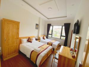 Postel nebo postele na pokoji v ubytování S481 Hoa Dang Hotel Dalat