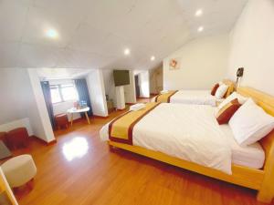 Postel nebo postele na pokoji v ubytování S481 Hoa Dang Hotel Dalat