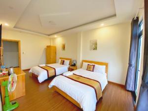Postel nebo postele na pokoji v ubytování S481 Hoa Dang Hotel Dalat