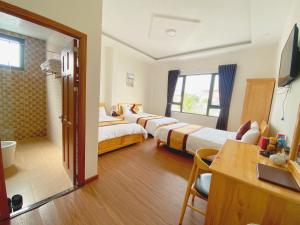 Postel nebo postele na pokoji v ubytování S481 Hoa Dang Hotel Dalat