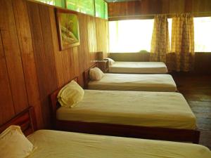 מיטה או מיטות בחדר ב-Curaka Lodge Expedition