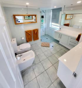 a bathroom with a sink and a toilet at 19th Avenue on the Beach in Gold Coast
