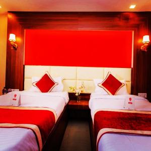 Letto o letti in una camera di Hotel Shraddha Palace