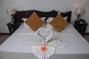 Postel nebo postele na pokoji v ubytování Hotel Chateau St Cloud