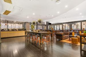 a dining room with a table and chairs at Style and Convenience on Little Bourke in Melbourne