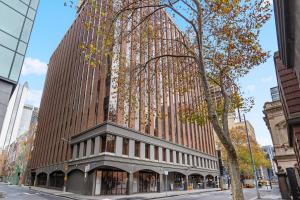a large building in a city with at Style and Convenience on Little Bourke in Melbourne