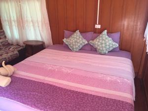 Postel nebo postele na pokoji v ubytování Sin U Rai Resort