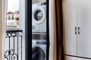 a washer and dryer sitting on a balcony at Studio apartment in Hoan Kiem in Hanoi