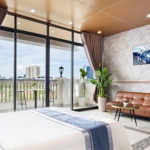 Postel nebo postele na pokoji v ubytování CAMY Hotel Vung Tau
