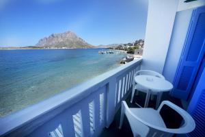 a balcony with a view of the ocean at Agialos Rooms in Kalymnos