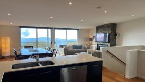 a kitchen and living room with a couch and a table at K2 - Thirteen in Mount Buller