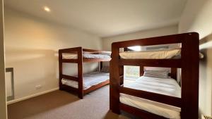 a room with two bunk beds in a room at K2 - Thirteen in Mount Buller