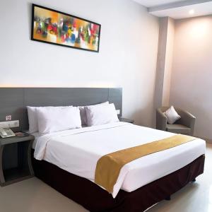 Voodi või voodid majutusasutuse Urban Style Hotel Lampung, Azana Hotels Collection toas
