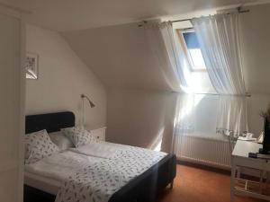 Posteľ alebo postele v izbe v ubytovaní Hotel Mlyn