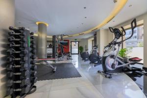 a fitness room with a gym with tread machines at Hotel Ciutadella Barcelona in Barcelona