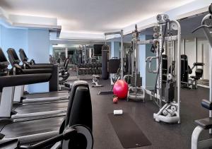 a gym with treadmills and machines in a room at OneLuxStay at W Residences in Fort Lauderdale