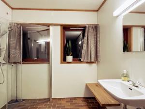 a bathroom with a sink and a shower at 19 person holiday home in Jøsenfjorden-By Traum in Gullingen