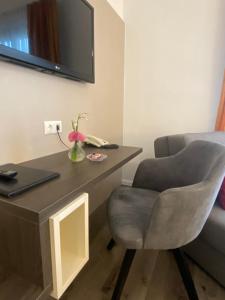 TV a/nebo společenská místnost v ubytování Simon - Hotel & Café