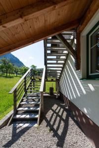 a stairway leading up to a building with a fence at Ferienwohnung Sonnenkind Altaussee in Altaussee