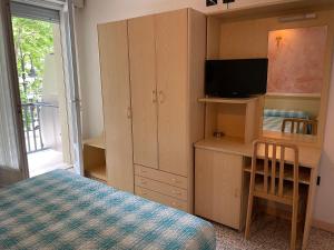 Postel nebo postele na pokoji v ubytování Piccolo Hotel