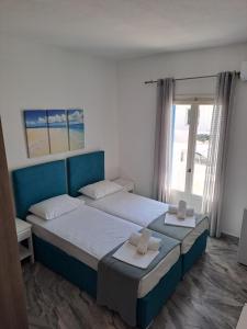 Ein Bett oder Betten in einem Zimmer der Unterkunft Frangiscos