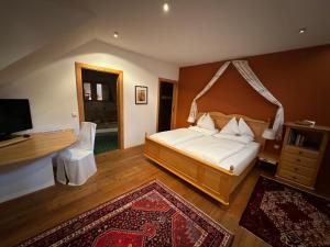 Postel nebo postele na pokoji v ubytování Panoramahotel Steirerland