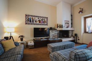 TV a/nebo společenská místnost v ubytování B&B L'Albero Dei Limoni