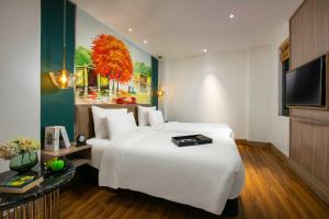 TV/trung tâm giải trí tại Aurora Premium - A Lifestyle Hotel