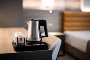 a coffee maker sitting on top of a table at Hotel Ivka in Dubrovnik