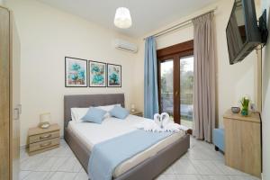 Postel nebo postele na pokoji v ubytování Maria Dina Apartments 1