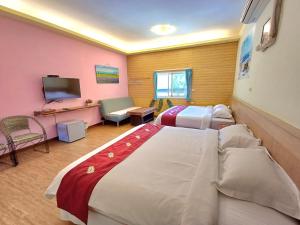 Vuode tai vuoteita majoituspaikassa 永旺旅店 Yong Wong Hostel