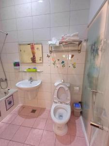 Kylpyhuone majoituspaikassa 永旺旅店 Yong Wong Hostel
