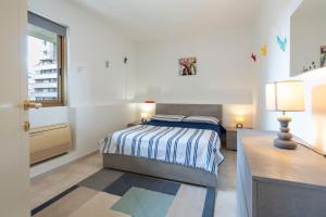 Ένα ή περισσότερα κρεβάτια σε δωμάτιο στο Oristano Home Sardinia