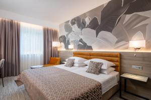 Ein Bett oder Betten in einem Zimmer der Unterkunft Hotel Ivka