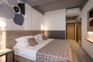 Ein Bett oder Betten in einem Zimmer der Unterkunft Hotel Ivka