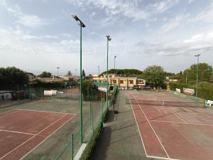 a tennis court with two tennis courts at Costa di Sopra Affittacamere in Quartu SantʼElena