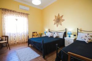 Postel nebo postele na pokoji v ubytování B&B L'Albero Dei Limoni