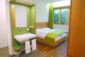 Posteľ alebo postele v izbe v ubytovaní Business Motel Feldkirch