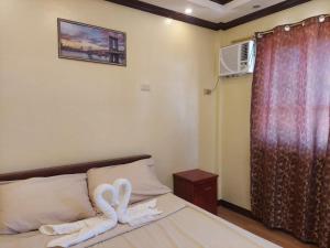 Postel nebo postele na pokoji v ubytování Simala Retreat Resort Cebu
