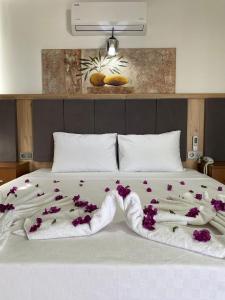 Voodi või voodid majutusasutuse Aristo 2 Butik Hotel toas
