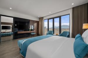 A bed or beds in a room at ViAn Hotel And Spa Danang