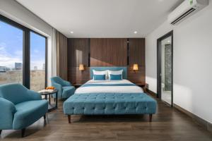 A bed or beds in a room at ViAn Hotel And Spa Danang