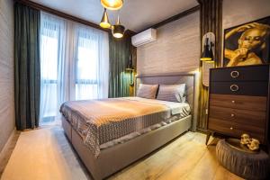 Giường trong phòng chung tại Lux Apart Karlovo 1
