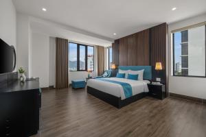 A bed or beds in a room at ViAn Hotel And Spa Danang